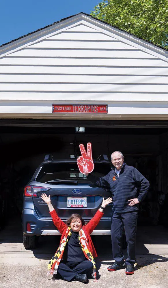 Diane and John Alahouzos proudly pose in front of their car, which features a "GOTERPS" license plate