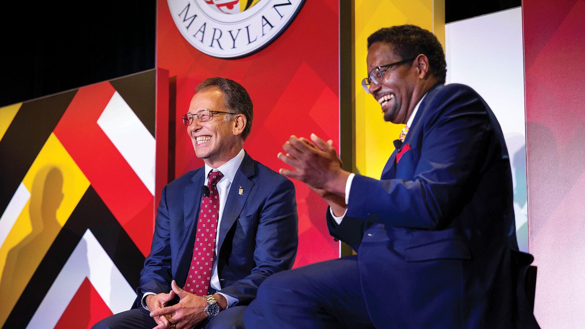 Jim Smith and Darryll J. Pines smile at introduction event
