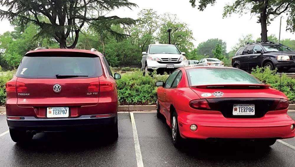 two red cars parked next to each other with TERP07 and TERP06 license plates