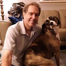 Douglas John Alick ’83 and dog
