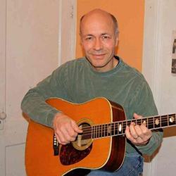 Russel "Russ/Rusty" Anthony Arlotta Jr. ’78 with guitar