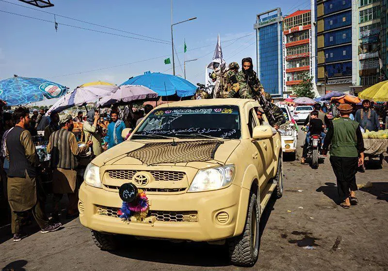 Taliban patrol rolls through Kabul in pickup