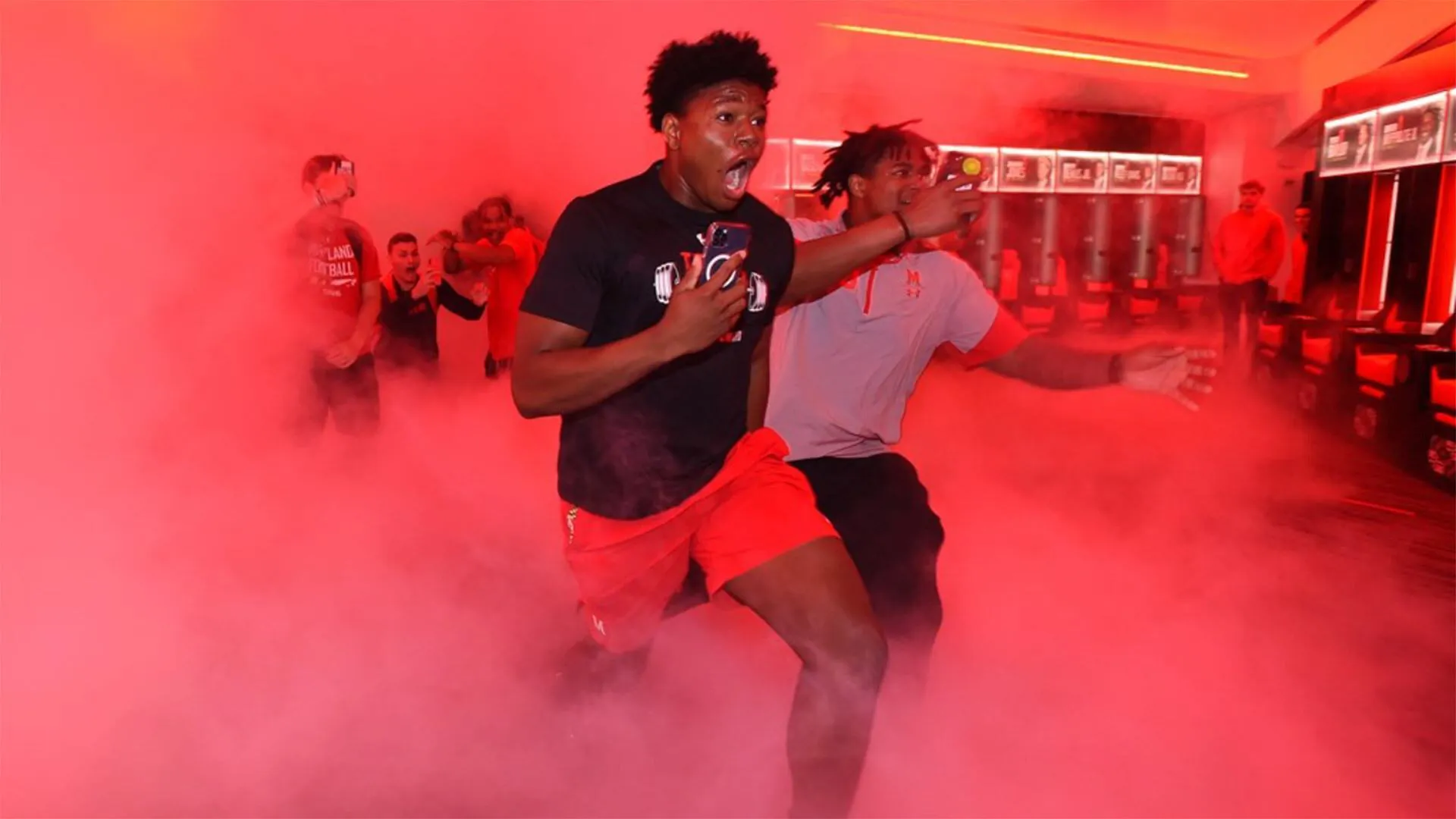 Football players run into new locker room