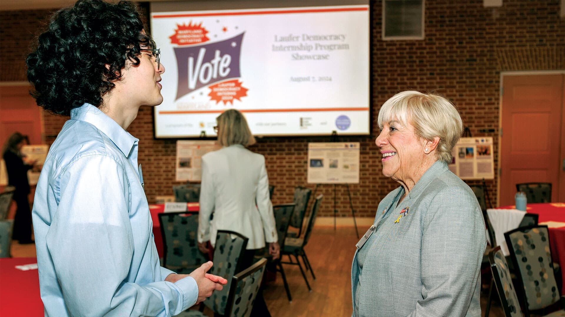 Marsha Laufer talks to student