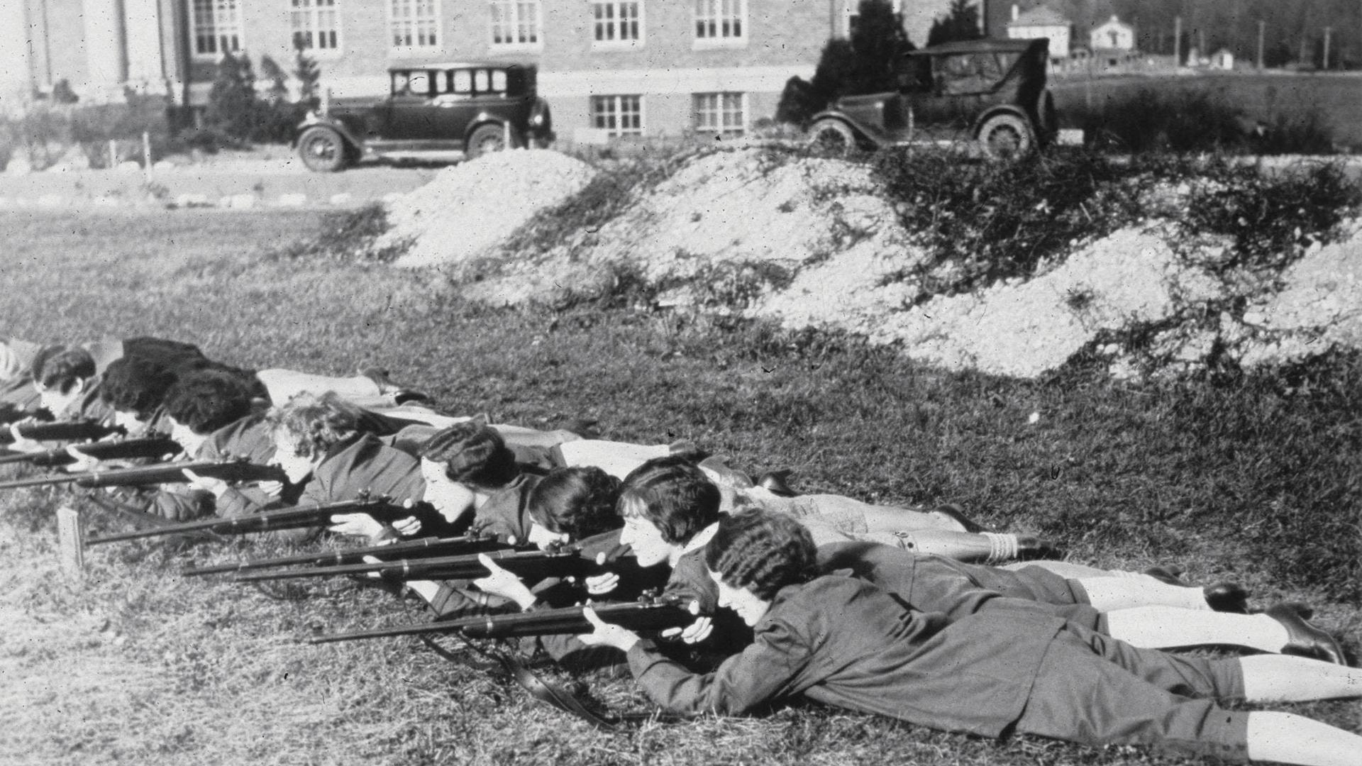 women's rifle team lies on ground to shoot