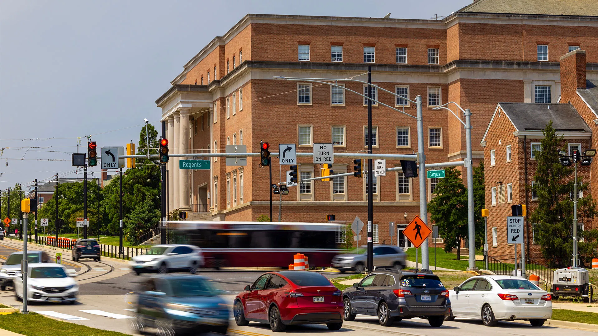 cars at stoplight at Regents Drive intersection
