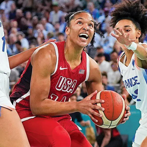 Alyssa Thomas holds basketball