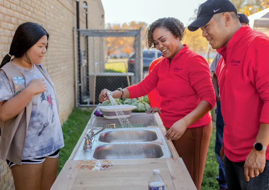 Joi Howard demonstrates vegetable washing