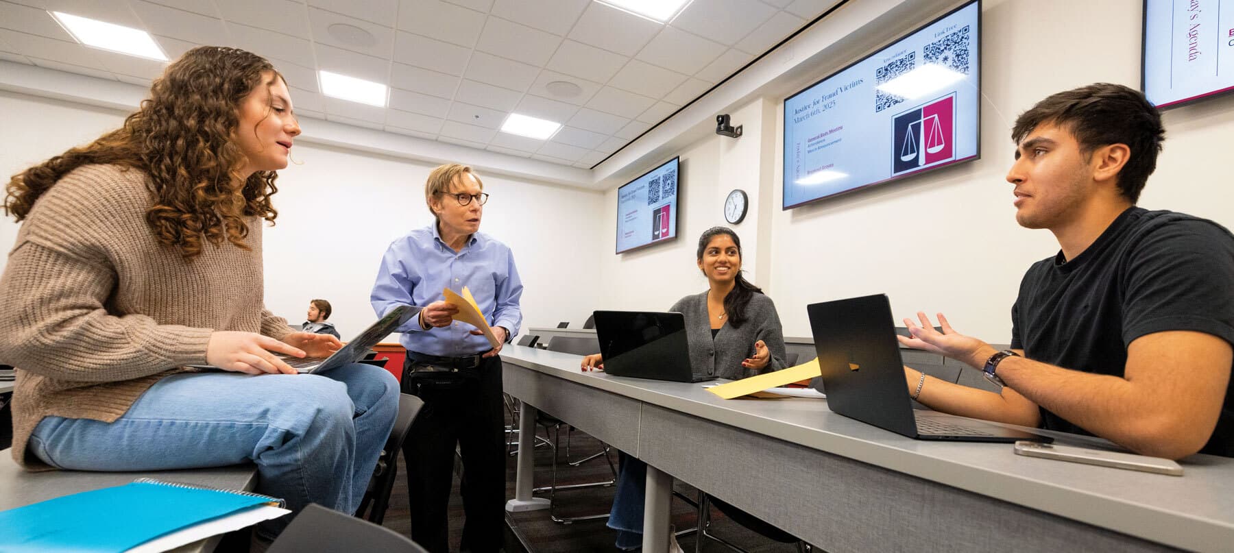 Lecturer Samuel Handwerger works with students