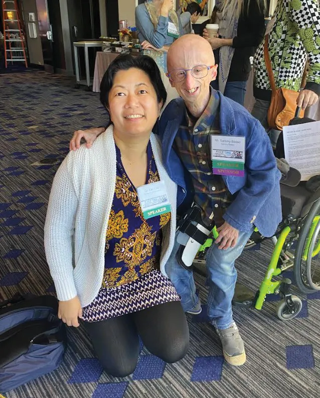 Kan Cao with Sammy Basso, a progeria patient