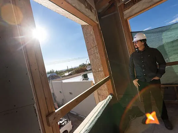 Kunkel looks out at the Sandia Mountains from the Barelas Community Kitchen
