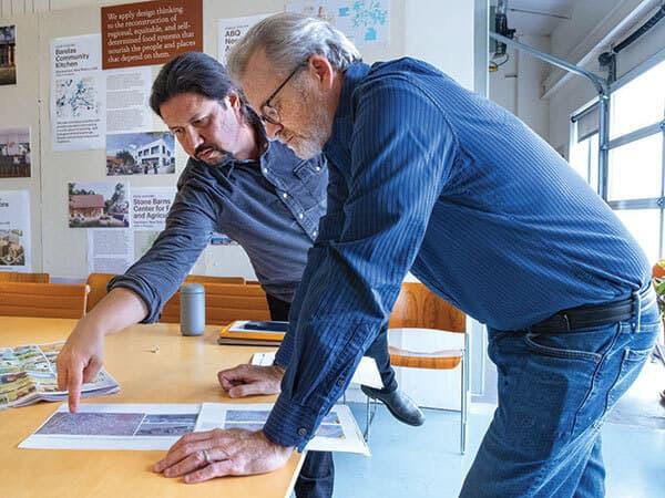 Joseph Kunkel and Shawn Evans of MASS Design Group review plans