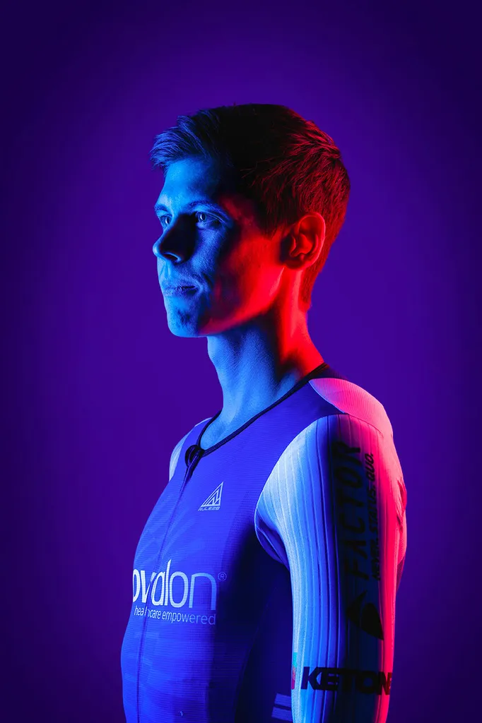 Ryan Collins poses in cycling jersey