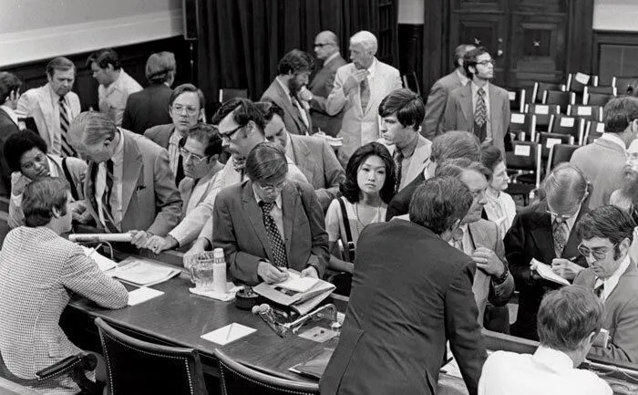 Connie Chung among crowd of white men