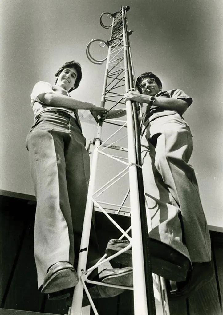 two students on radio tower