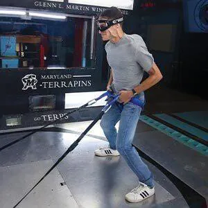 man strapped into wind tunnel