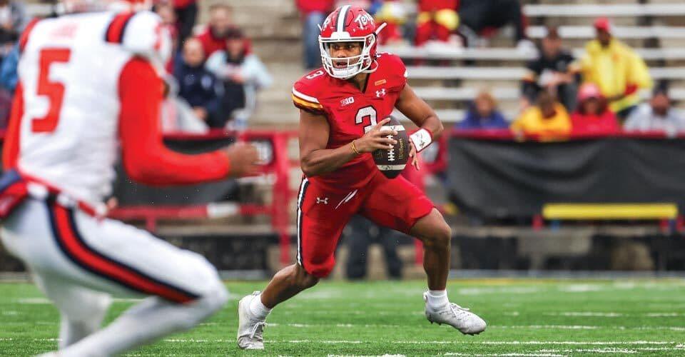 Taulia Tagovailoa looks to pass football